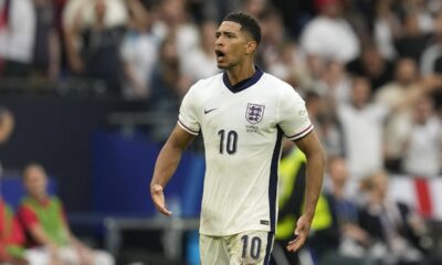 England's Jude Bellingham celebrates after scoring his side's opening goal during a round of sixteen match between England and Slovakia at the Euro 2024 soccer tournament in Gelsenkirchen, Germany, Sunday, June 30, 2024. (AP Photo/Antonio Calanni)