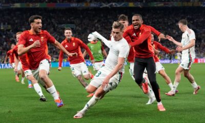 Hungary's coach Marco Rossi celebrates with players at the end of a Group A match between Scotland and Hungary at the Euro 2024 soccer tournament in Stuttgart, Germany, Sunday, June 23, 2024. (AP Photo/Antonio Calanni)