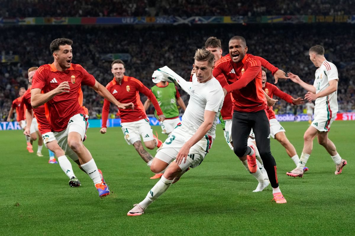 Hungary's coach Marco Rossi celebrates with players at the end of a Group A match between Scotland and Hungary at the Euro 2024 soccer tournament in Stuttgart, Germany, Sunday, June 23, 2024. (AP Photo/Antonio Calanni)