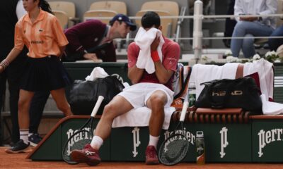 Serbia's Novak Djokovic dries his face during a changeover in his fourth round match of the French Open tennis tournament at the Roland Garros stadium in Paris, Monday, June 3, 2024. (AP Photo/Thibault Camus)