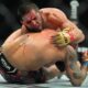Russia's Islam Makhachev, above, grapples with Dustin Poirier during the fifth round of a lightweight title bout at the UFC 302 mixed martial arts event early Sunday, June 2, 2024, in Newark, N.J. Makhachev won the bout. (AP Photo/Frank Franklin II)