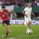 Austria's Christoph Baumgartner, left, scores during an international friendly soccer match between Austria and Serbia at the Ernst Happel Stadion in Vienna, Austria, Tuesday, June 4, 2024. (AP Photo/Matthias Schrader)