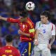 Spain's Alvaro Morata (7) and Italy's Riccardo Calafiori (5) battle for a header during a Group B match between Spain and Italy at the Euro 2024 soccer tournament in Gelsenkirchen, Germany, Thursday, June 20, 2024. (AP Photo/Manu Fernandez)