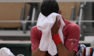 Serbia's Novak Djokovic dries his face during a changeover in his fourth round match of the French Open tennis tournament at the Roland Garros stadium in Paris, Monday, June 3, 2024. (AP Photo/Thibault Camus)