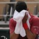 Serbia's Novak Djokovic dries his face during a changeover in his fourth round match of the French Open tennis tournament at the Roland Garros stadium in Paris, Monday, June 3, 2024. (AP Photo/Thibault Camus)