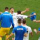 Slovenia's Erik Janza, on the ground, celebrates after scoring his side's first goal during a Group C match between Slovenia and Denmark at the Euro 2024 soccer tournament in Stuttgart, Germany, Sunday, June 16, 2024. (AP Photo/Ariel Schalit)