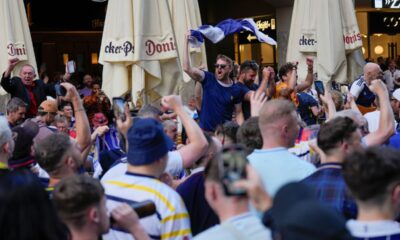 Scotland's soccer team fans cheer in 'Marienplatz' square next to the town hall in downtown Munich, Germany, Thursday, June 13, 2024. The Euro 2024 soccer tournament takes place in Germany from June 14 until July 14. (AP Photo/Ariel Schalit)