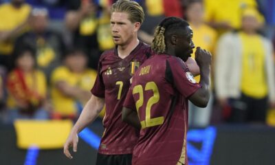 Belgium's Kevin De Bruyne, left, and Belgium's Jeremy Doku gather during a Group E match between Belgium and Romania at the Euro 2024 soccer tournament in Cologne, Germany, Saturday, June 22, 2024. (AP Photo/Martin Meissner)