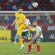 Romania's Razvan Marin hits a header next to Bulgaria's Vasil Panayotov during an international friendly soccer match between Romania and Bulgaria at the Steaua stadium in Bucharest, Romania, Tuesday, June 4, 2024.(AP Photo/Andreea Alexandru)