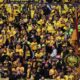 Dortmund supporters wait for the start of the Champions League final soccer match between Borussia Dortmund and Real Madrid at Wembley stadium in London, Saturday, June 1, 2024. (AP Photo/Ian Walton)