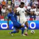England's Jude Bellingham, right, moves the ball as Slovenia's Vanja Drkusic reaches in during a Group C match between the England and Slovenia at the Euro 2024 soccer tournament in Cologne, Germany, Tuesday, June 25, 2024. (AP Photo/Frank Augstein)