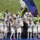 Real Madrid players celebrate with the Champions League trophy at the end of the Champions League final soccer match between Borussia Dortmund and Real Madrid at Wembley stadium in London, Saturday, June 1, 2024. Real Madrid won 2-0. (AP Photo/Alastair Grant)