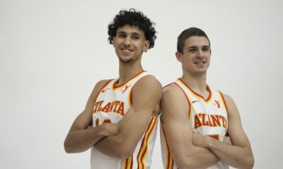 Atlanta Hawks' Zaccharie Risacher, left and Nikola Djurišić, right, poses for a photograph after a news conference, Friday, June 28, 2024, in Atlanta. Risacher was selected as the first overall pick by the Atlanta Hawks in the first round of the NBA basketball draft. AP Photo/Brynn Anderson)