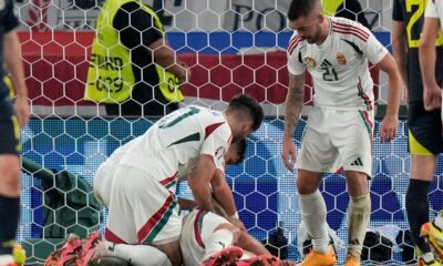 Hungary's Barnabas Varga, lies on the pitch after a collision during a Group A match between Scotland and Hungary at the Euro 2024 soccer tournament in Stuttgart, Germany, Sunday, June 23, 2024. (AP Photo/Matthias Schrader)