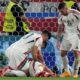 Hungary's Barnabas Varga, lies on the pitch after a collision during a Group A match between Scotland and Hungary at the Euro 2024 soccer tournament in Stuttgart, Germany, Sunday, June 23, 2024. (AP Photo/Matthias Schrader)