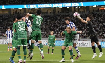 Tokyo Verdy's goalkeeper Yuya Nagasawa, right, makes a save during the friendly soccer match between Real Sociedad and Tokyo Verdy at the National Stadium Wednesday, May 29, 2024, in Tokyo. (AP Photo/Eugene Hoshiko)