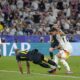 Scotland's Ryan Porteous, center left, fouls Germany's Ilkay Gundogan to give away a penalty during a Group A match between Germany and Scotland at the Euro 2024 soccer tournament in Munich, Germany, Friday, June 14, 2024. (AP Photo/Matthias Schrader)