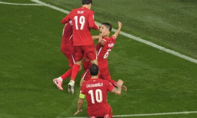 CORRECTS ID TO ARDA GULER - Turkey's Arda Guler, rear right, celebrates after scoring his side's second goal during a Group F match between Turkey and Georgia at the Euro 2024 soccer tournament in Dortmund, Germany, Tuesday, June 18, 2024. (AP Photo/Andreea Alexandru)