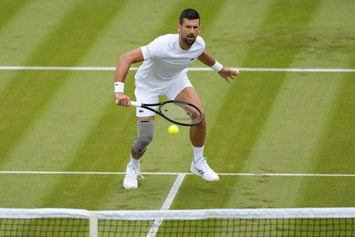 Novak Djokovic of Serbia plays a return during a training session on Court 2 at the All England Lawn Tennis and Croquet Club in Wimbledon, London, Friday, June 28, 2024. The Wimbledon Championships begin on July 1. (AP Photo/Kirsty Wigglesworth)