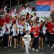 U Rio de Žaneiru 2016. godine zastavu je nosila Ivana Anđušić Maksimović, srebrna strelkinja iz Londona 2012. godine. Na Igrama u Londonu 2012. godine, zastavu je nosio najbolji teniser sveta Novak Đoković, dok je na OI u Pekingu 2008. godine ta čast pripala strelkinji Jasni Šekarić, petostrukoj osvajačici medalja za Srbiju.