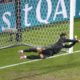 Portugal's goalkeeper Diogo Costa saves the ball during penalties of a round of sixteen match between Portugal and Slovenia at the Euro 2024 soccer tournament in Frankfurt, Germany, Monday, July 1, 2024. (AP Photo/Michael Probst)