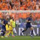 Cody Gakpo of the Netherlands celebrates scoring his side's opening goal during a round of sixteen match between Romania and the Netherlands at the Euro 2024 soccer tournament in Munich, Germany, Tuesday, July 2, 2024. (AP Photo/Matthias Schrader)
