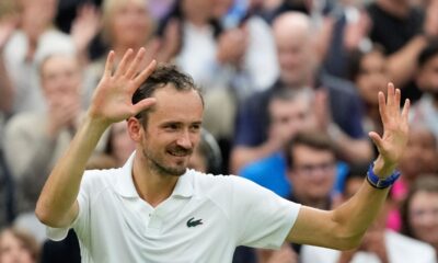 Daniil Medvedev of Russia celebrates after defeating Jannik Sinner of Italy in their quarterfinal match at the Wimbledon tennis championships in London, Tuesday, July 9, 2024. (AP Photo/Mosa'ab Elshamy)