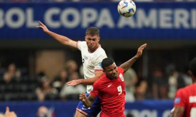 Joe Scally of the United States, top, and Panama's Eduardo Guerrero vie for the ball during a Copa America Group C soccer match in Atlanta, Thursday, June 27, 2024. (AP Photo/Jason Allen)