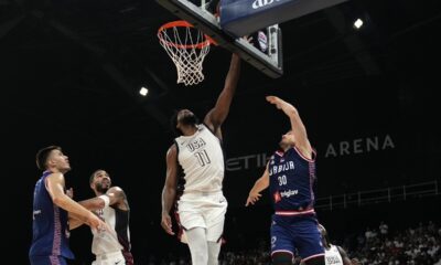 Serbia's Aleksa Avramovic, right, scores during an exhibition basketball match between Serbia and the United States at the USA Basketball Showcase, ahead of the 2024 Paris Olympic basketball tournament, in Abu Dhabi, United Arab Emirates, Wednesday, July 17, 2024. (AP Photo/Altaf Qadri)