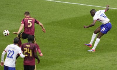 Randal Kolo Muani of France takes a shot that was deflected in the net by Belgium's Jan Vertonghen during a round of sixteen match between France and Belgium at the Euro 2024 soccer tournament in Duesseldorf, Germany, Monday, July 1, 2024. (AP Photo/Andreea Alexandru)