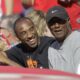 FILE - Los Angeles Lakers' Kobe Bryant, left, talks to his father, Joe, as they watch a baseball game between the Los Angeles Angels and the Los Angeles Dodgers in Anaheim, Calif., Sunday, June 21, 2009. Joe “Jellybean” Bryant has died, his alma mater announced Tuesday, July 16, 2024. Joe Bryant, who spent eight seasons in the NBA with three different franchises, was 69. The Philadelphia Inquirer, citing La Salle coach Fran Dunphy, reported that Joe Bryant recently had a massive stroke. (AP Photo/Jae C. Hong, File)