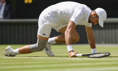 Serbia's Novak Djokovic falls during his second round match against Britain's Jacob Fearnley at the Wimbledon tennis championships in London, Thursday, July 4, 2024. (AP Photo/Kirsty Wigglesworth)