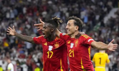 Spain's Mikel Oyarzabal celebrates with Nico Williams, left, after scoring his side's second goal during the final match between Spain and England at the Euro 2024 soccer tournament in Berlin, Germany, Sunday, July 14, 2024. (AP Photo/Manu Fernandez)