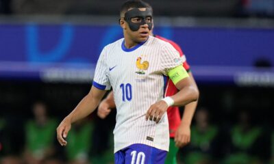 Kylian Mbappe of France looks over his shoulder during a quarter final match against Portugal at the Euro 2024 soccer tournament in Hamburg, Germany, Friday, July 5, 2024. (AP Photo/Hassan Ammar)