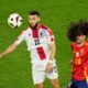 Georgia's Georges Mikautadze, left, controls the ball next to Spain's Marc Cucurella during a round of sixteen match at the Euro 2024 soccer tournament in Cologne, Germany, Sunday, June 30, 2024. (AP Photo/Andreea Alexandru)