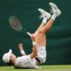 Alex de Minaur of Australia falls during his fourth round match against Arthur Fils of France at the Wimbledon tennis championships in London, Monday, July 8, 2024. (AP Photo/Alberto Pezzali)