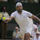 FILE - Australia's Nick Kyrgios returns to Serbia's Novak Djokovic in the final of the men's singles on the 14th day of the Wimbledon tennis championships in London, July 10, 2022. Kyrgios has played just one official singles match since October 2022 because of injuries, but Djokovic said Friday. July 12, 2024, that Kyrgios told him a return might happen at the U.S. Open. (AP Photo/Alastair Grant, File)