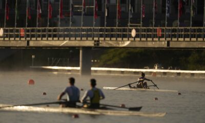 Athletes train ahead of the day's rowing competitions at the 2024 Summer Olympics, Sunday, July 28, 2024, in Vaires-sur-Marne, France. (AP Photo/Lindsey Wasson)