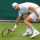 Grigor Dimitrov of Bulgaria plays a forehand return to Dusan Lajovic of Serbia during their first round match of the Wimbledon tennis championships in London, Monday, July 1, 2024. (AP Photo/Kirsty Wigglesworth)