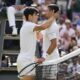 Carlos Alcaraz, left, of Spain is congratulated by Novak Djokovic of Serbia after winning the men's singles final at the Wimbledon tennis championships in London, Sunday, July 14, 2024. (AP Photo/Kirsty Wigglesworth)