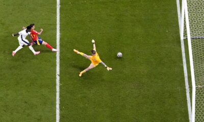 Spain's Mikel Oyarzabal, center, scores his side's second goal during the final match between Spain and England at the Euro 2024 soccer tournament in Berlin, Germany, Sunday, July 14, 2024. (AP Photo/Thanassis Stavrakis)