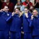 The United States men's 4x100-meter freestyle relay team celebrate as they stand on the podium after winning the gold medal at the 2024 Summer Olympics, Saturday, July 27, 2024, in Nanterre, France. (AP Photo/Petr David Josek)