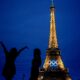 The United States' Amarilees Bolorin, left, takes a selfie with a friend in front of the Eiffel Tower ahead of the 2024 Summer Olympics, Thursday, July 25, 2024, in Paris, France. (AP Photo/Natacha Pisarenko)