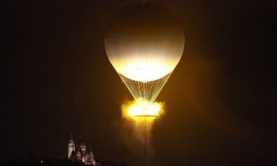 The cauldron, with the Olympic flame lit, lifts off while attached to a balloon, in Paris, France, during the opening ceremony of the 2024 Summer Olympics, Friday, July 26, 2024. (Peter Cziborra/Pool Photo via AP)