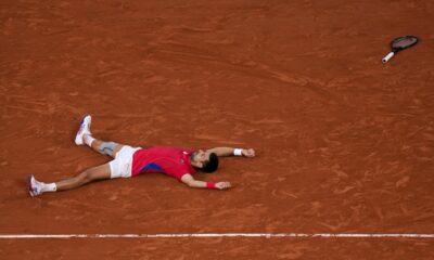Novak Djokovic of Serbia celebrates after defeating Lorenzo Musetti of Italy in their men's singles semifinals tennis match, at the 2024 Summer Olympics, Friday, Aug. 2, 2024, at the Roland Garros stadium in Paris, France. (AP Photo/Manu Fernandez)