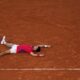 Novak Djokovic of Serbia celebrates after defeating Lorenzo Musetti of Italy in their men's singles semifinals tennis match, at the 2024 Summer Olympics, Friday, Aug. 2, 2024, at the Roland Garros stadium in Paris, France. (AP Photo/Manu Fernandez)