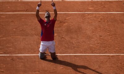 Serbia's Novak Djokovic reacts after defeating Spain's Carlos Alcaraz in the men's singles tennis final at the Roland Garros stadium during the 2024 Summer Olympics, Sunday, Aug. 4, 2024, in Paris, France. (AP Photo/Andy Wong)
