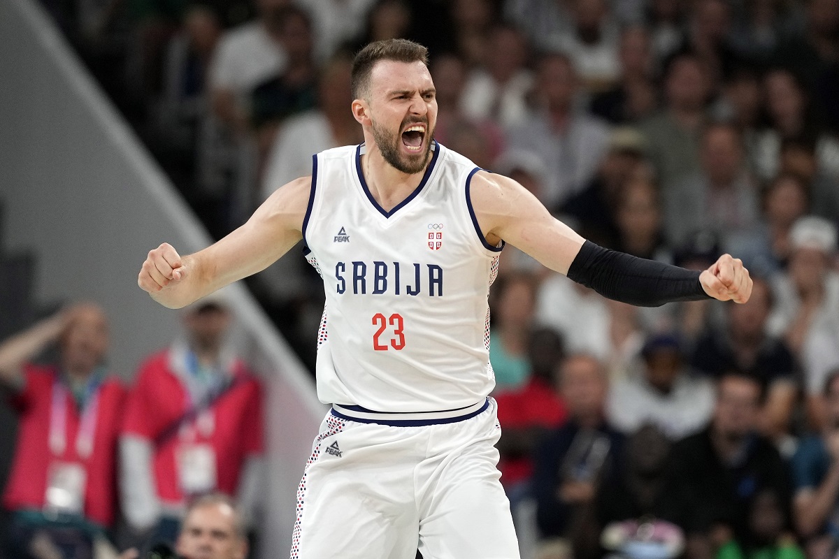 Serbia's Marko Guduric celebrates after Serbia scored during a men's basketball game against South Sudan at the 2024 Summer Olympics, Saturday, Aug. 3, 2024, in Villeneuve-d'Ascq, France. (AP Photo/Michael Conroy)
