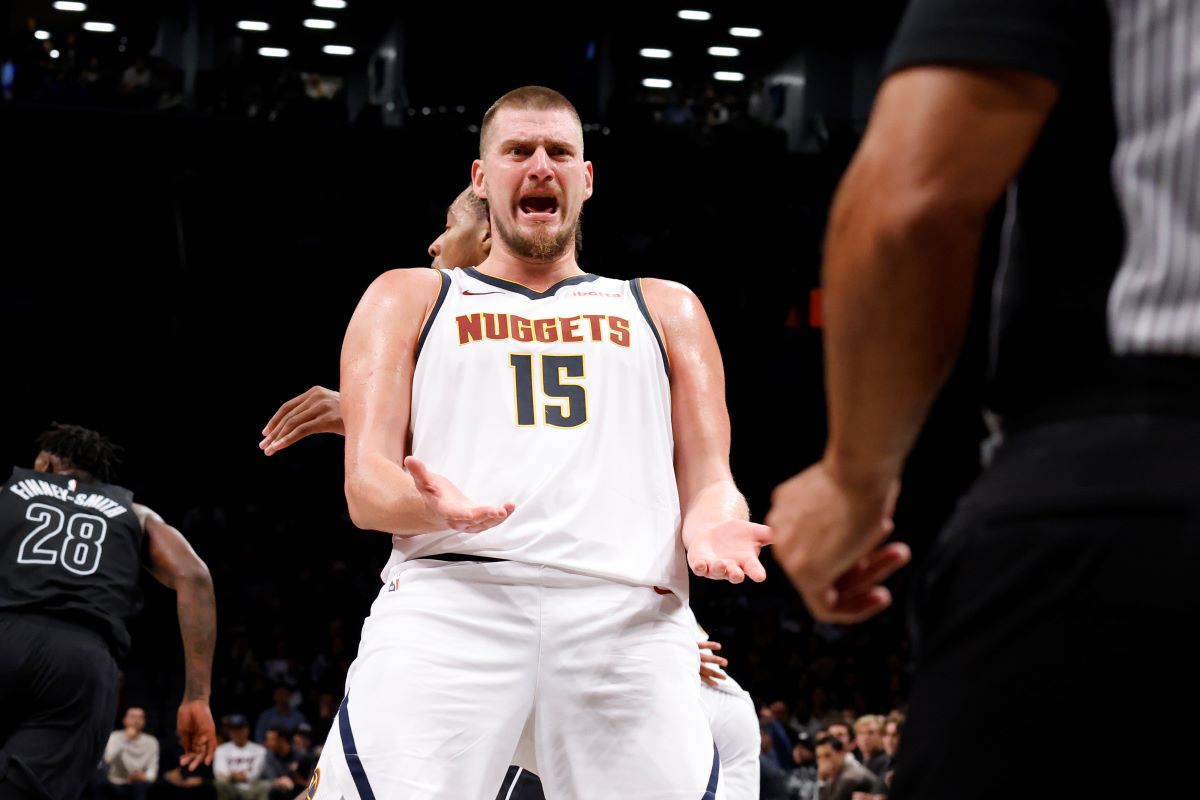 Denver Nuggets' Nikola Jokic (15), of Serbia, reacts to a call during the third quarter of an NBA basketball game against the Brooklyn Nets, Tuesday, Oct. 29, 2024, in New York. (AP Photo/Jason DeCrow)