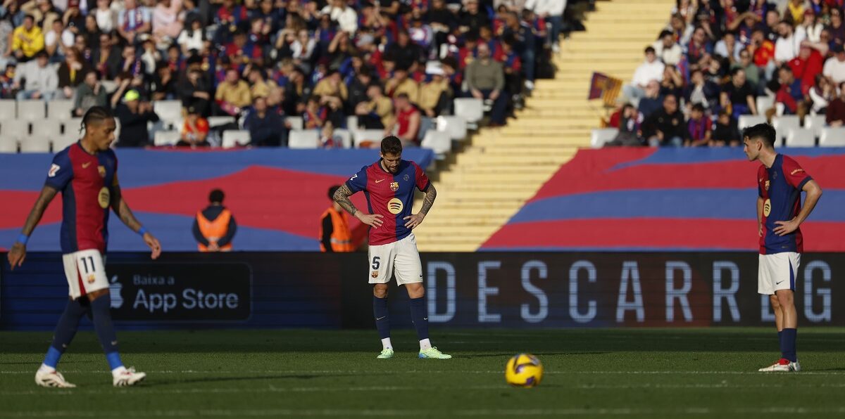 Barcelona's players react after the second goal of Las Palmas during a Spanish La Liga soccer match at the Lluis Companys Olympic Stadium in Barcelona, Spain, Saturday Nov. 30, 2024. (AP Photo/Joan Monfort)
